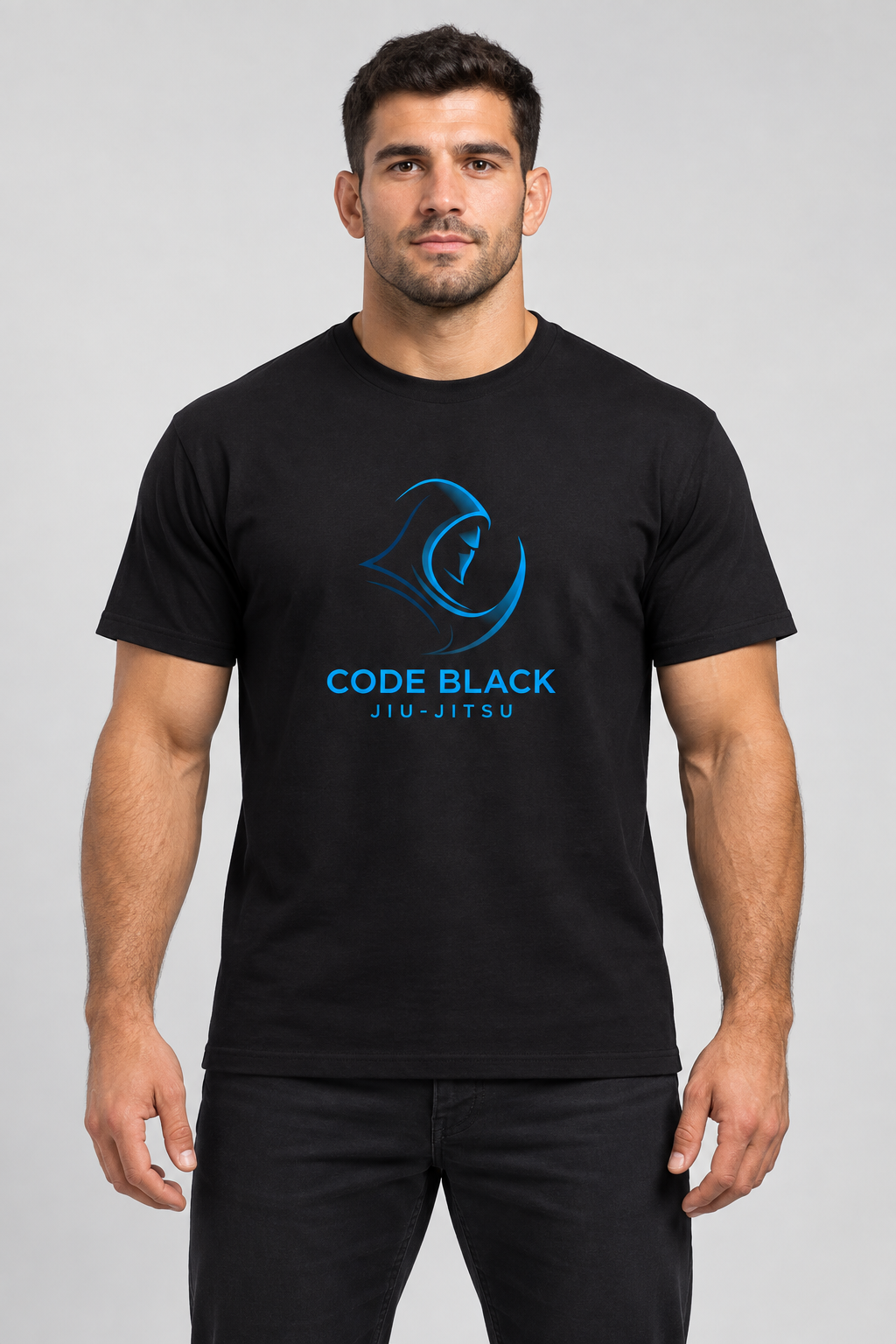 Product mockup of a male model wearing the black Code Black T-shirt with the blue academy logo